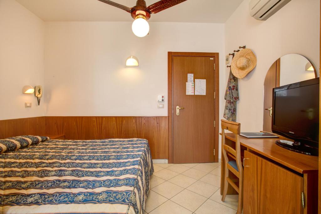 Postel nebo postele na pokoji v ubytování Hotel Genzianella