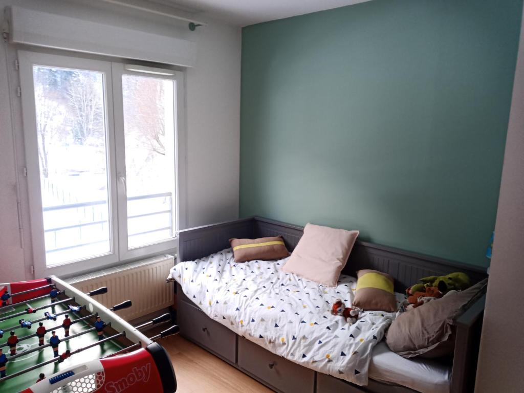 a bedroom with a bed with toys on it at Apartment In Allemont in Allemont