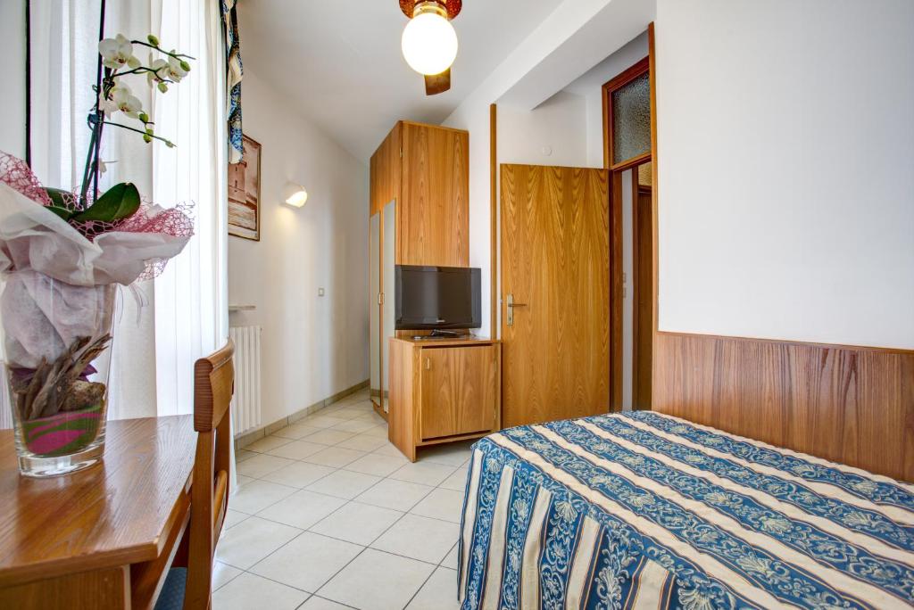 Postel nebo postele na pokoji v ubytování Hotel Genzianella