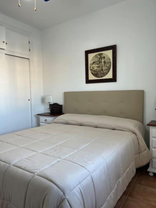 Łóżko lub łóżka w pokoju w obiekcie Casa duplex en chipiona