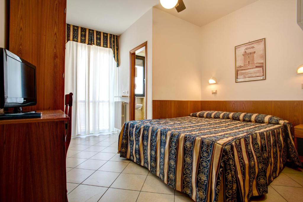 Postel nebo postele na pokoji v ubytování Hotel Genzianella