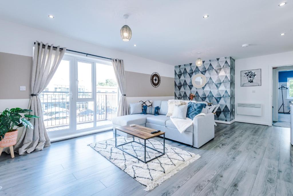 a living room with a couch and a table at Stunning 2 Bed Apt By Greenstay Serviced Accommodation - Located in Formby Village - Perfect For SHORT & LONG STAYS - Couples, Friends & Families & Business Travellers All Welcome - Dog Friendly - 7 in Formby