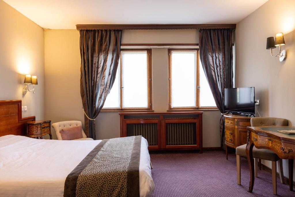 Postel nebo postele na pokoji v ubytování Parc Hôtel