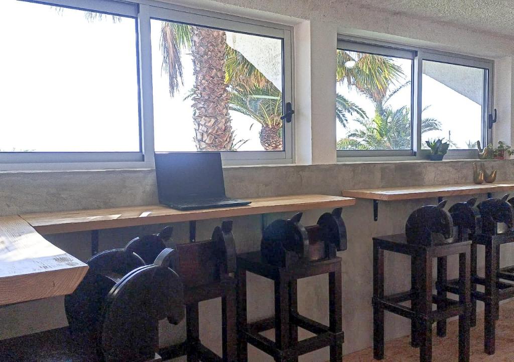 a classroom with a desk with a laptop computer on it at Porto Santo Destination in Porto Santo