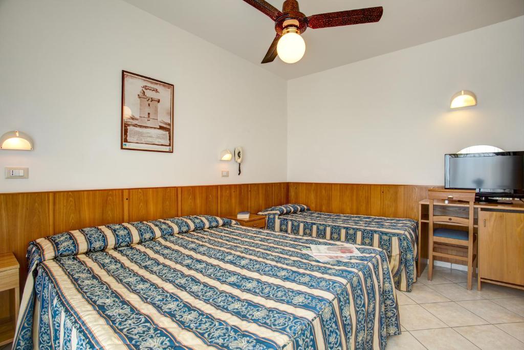 Postel nebo postele na pokoji v ubytování Hotel Genzianella