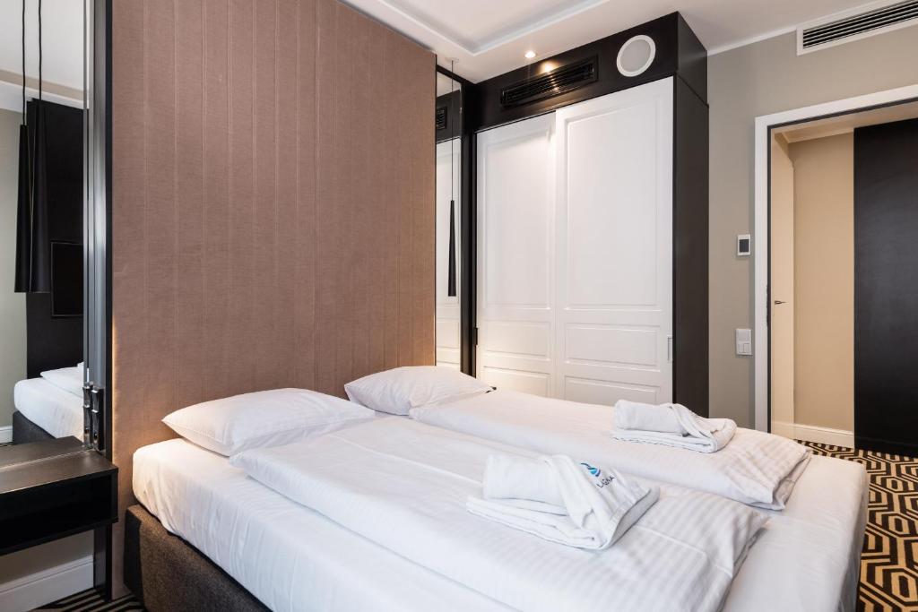 Posteľ alebo postele v izbe v ubytovaní Baltic Park Fort Promenada Apartment Świnoujście by Noclegi Renters