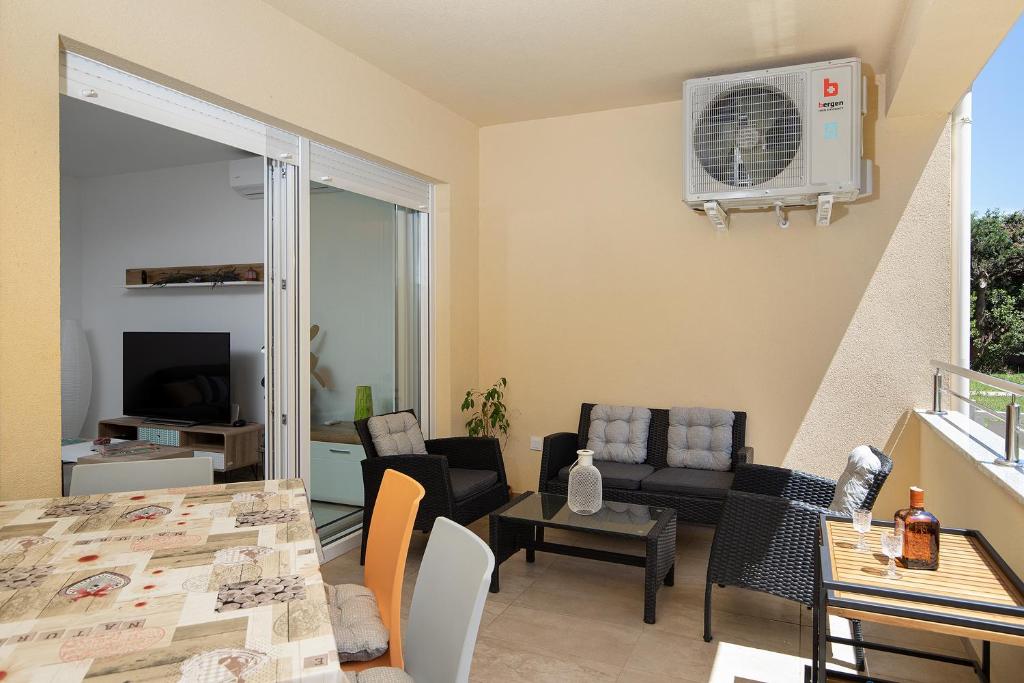 Telewizja i/lub zestaw kina domowego w obiekcie Apartment J&E