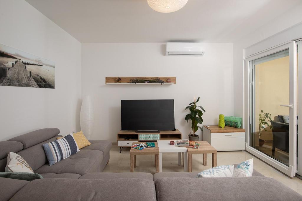 Telewizja i/lub zestaw kina domowego w obiekcie Apartment J&E
