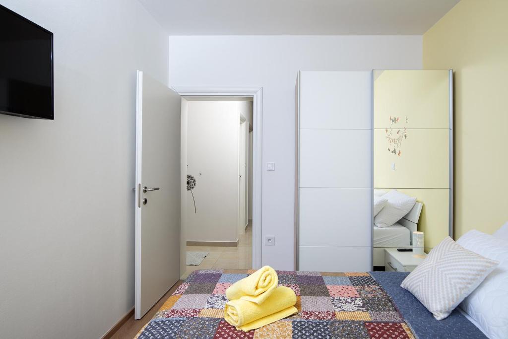 Łóżko lub łóżka w pokoju w obiekcie Apartment J&E