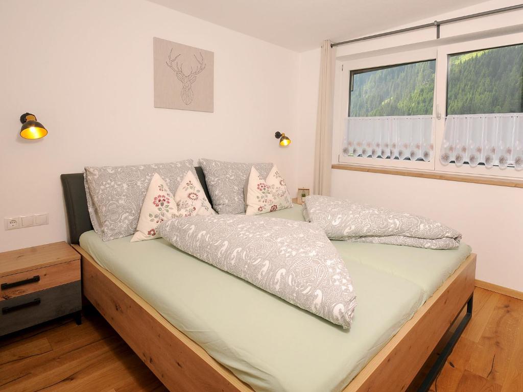 Postel nebo postele na pokoji v ubytování Apartment Wanglblick by Interhome