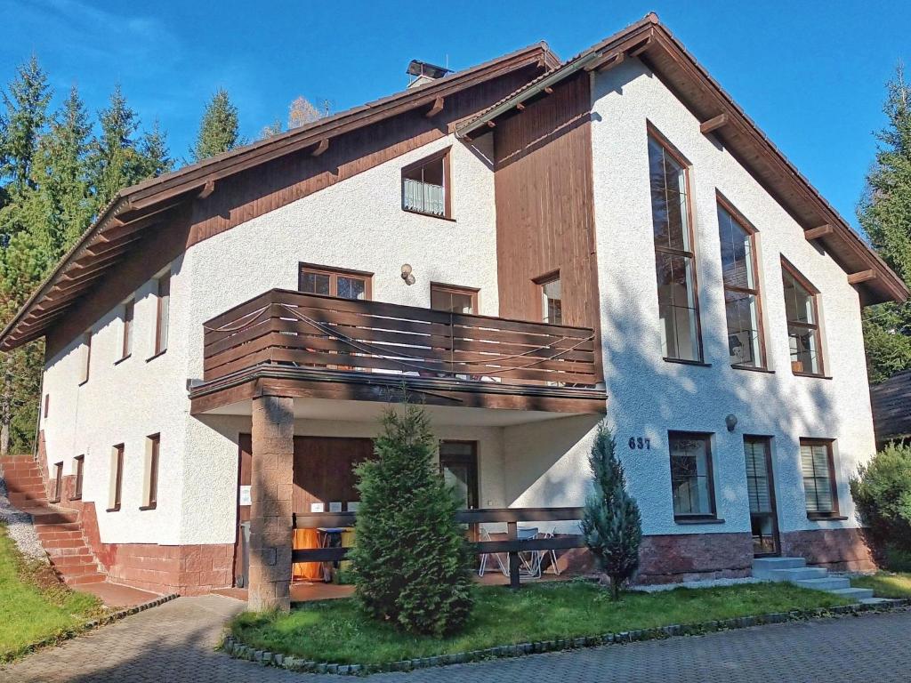 a large house with a balcony on top of it at Apartment 637-2 by Interhome in Harrachov