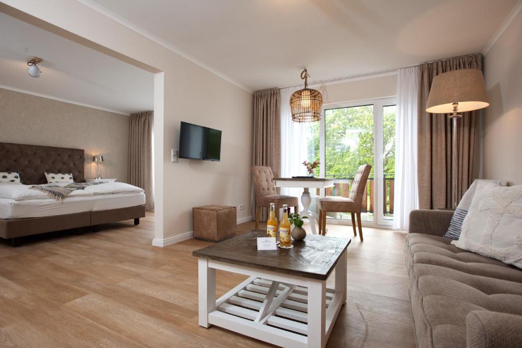 Postel nebo postele na pokoji v ubytování Aparthotel Friesenhof