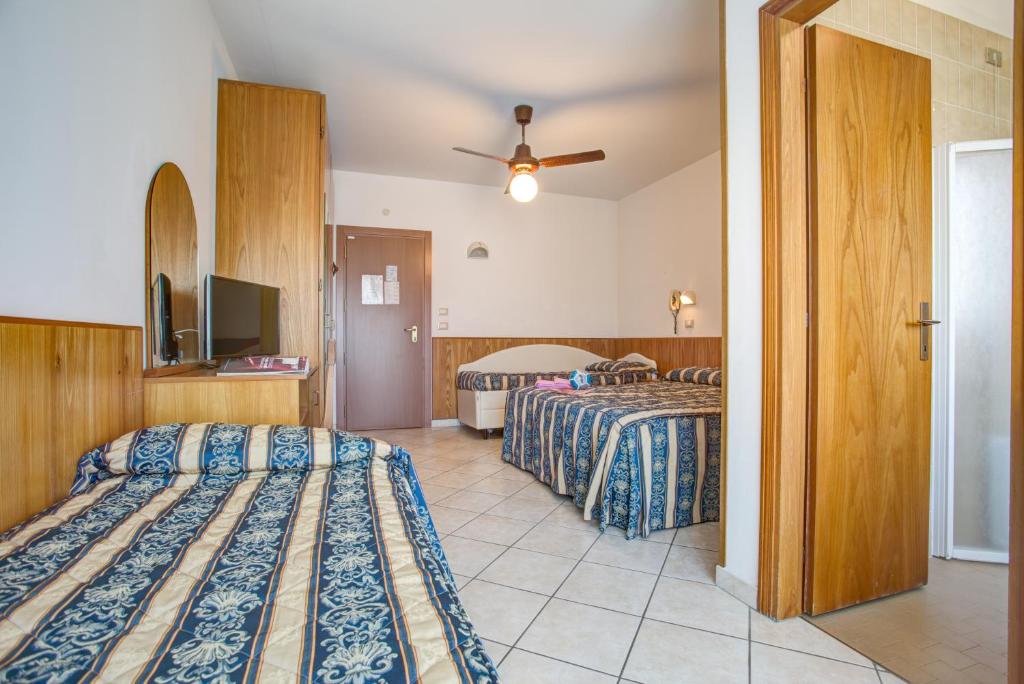 Postel nebo postele na pokoji v ubytování Hotel Genzianella
