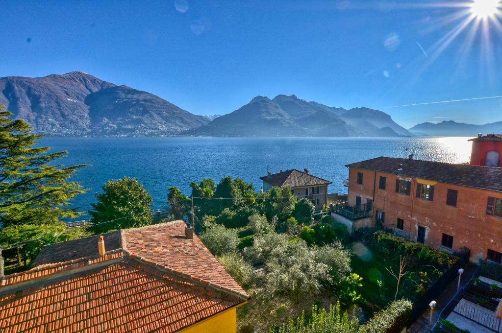 a view of a large body of water with mountains at 2-Bedroom Airconditioned Lakeview Apartment in Acquaseria