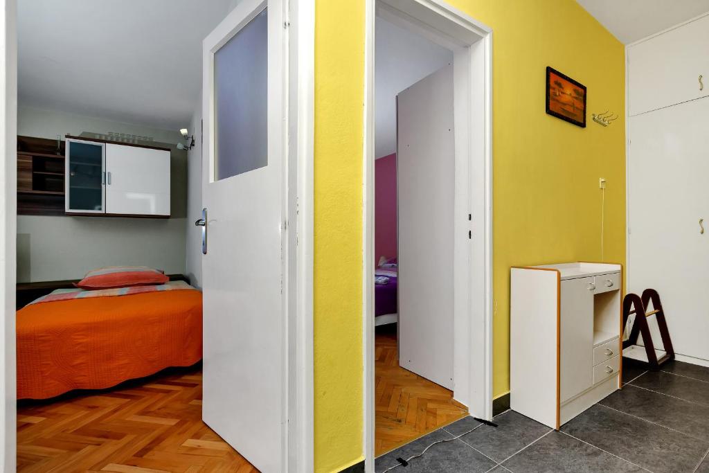Posteľ alebo postele v izbe v ubytovaní Apartman Goranka