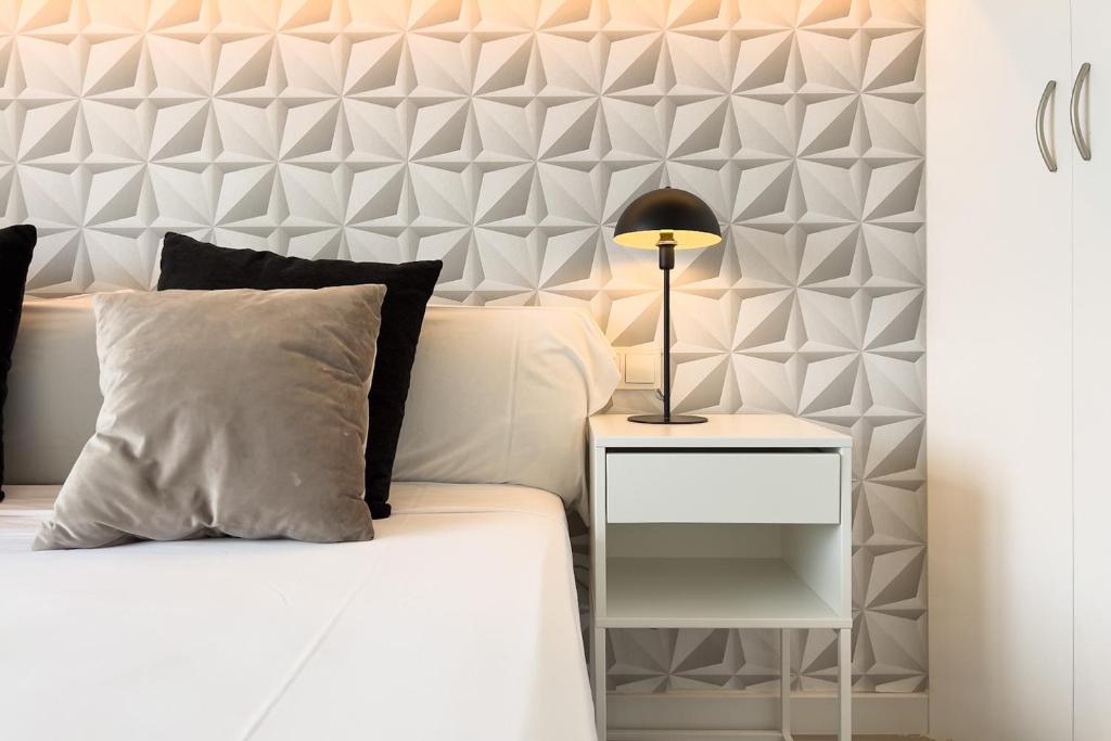 Posteľ alebo postele v izbe v ubytovaní chicStays Apartment Ciutadella Park