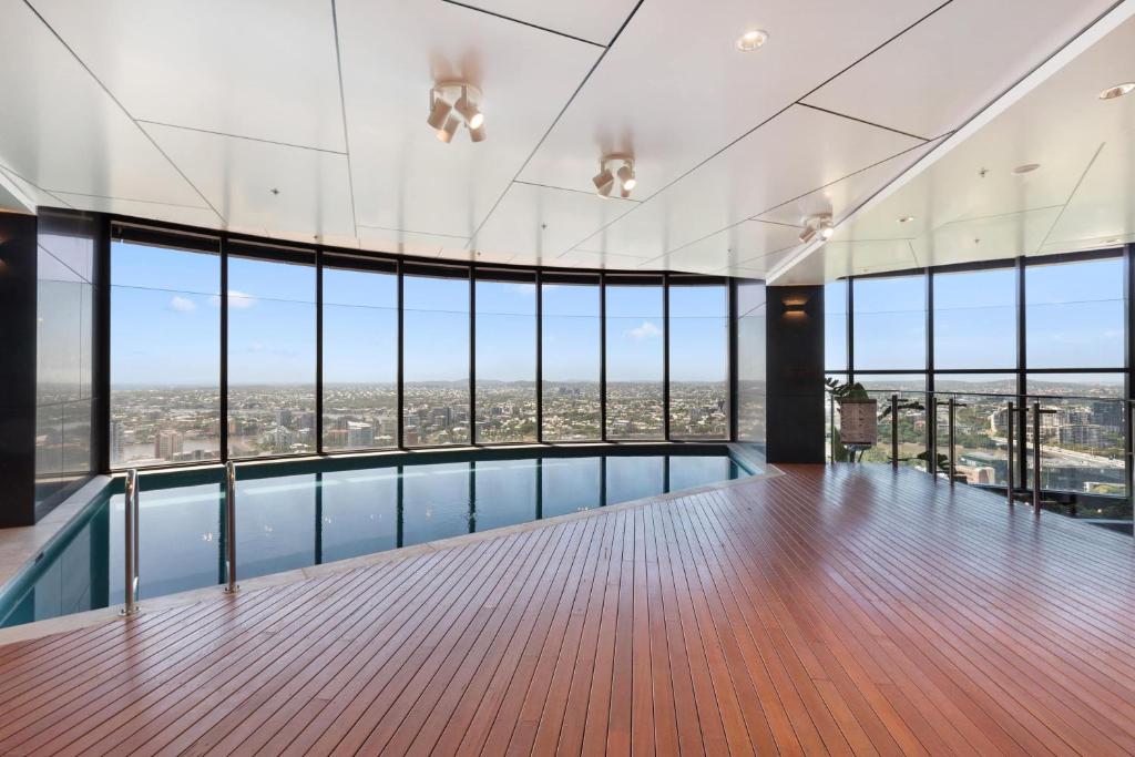 a view from the top of a building with a pool at CBD RiverView 2Bed Apt Kingbed at Tallest building in Brisbane