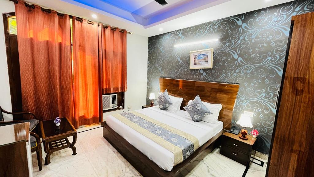 Postel nebo postele na pokoji v ubytování Hotel Starline Sector 28