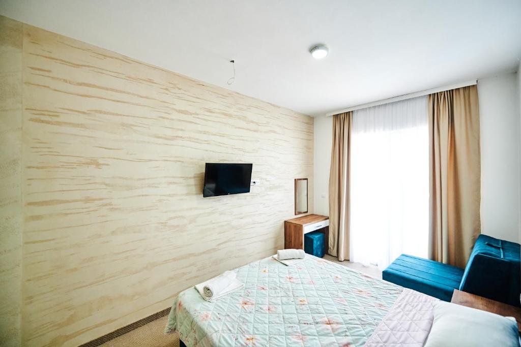 TV a/nebo společenská místnost v ubytování Hotel Halibas