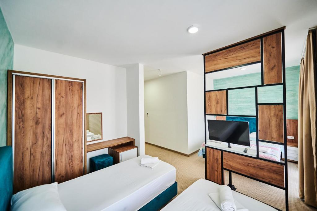 Postel nebo postele na pokoji v ubytování Hotel Halibas