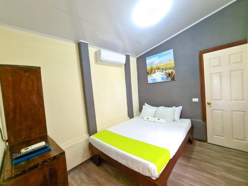 Postel nebo postele na pokoji v ubytování Cabinas Coco Alegre