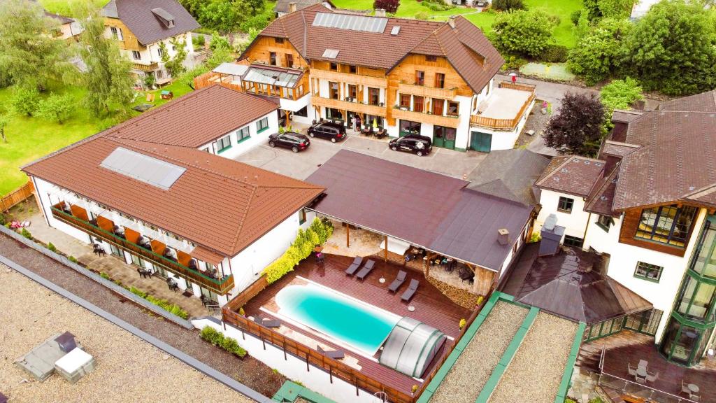 an aerial view of a house with a swimming pool at Sylpaulerhof Aparthotel in Sankt Michael im Lungau