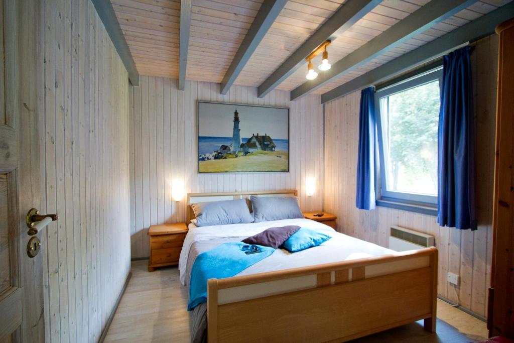 a bedroom with a bed in a room with a window at Ferienhaus Mirow 66 in Mirow