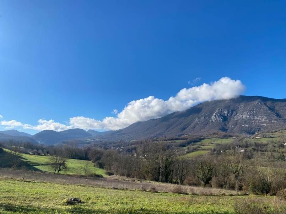 a view of a valley with mountains in the background at Spacieux logement au pied du Vercors in Saint-Jean-en-Royans