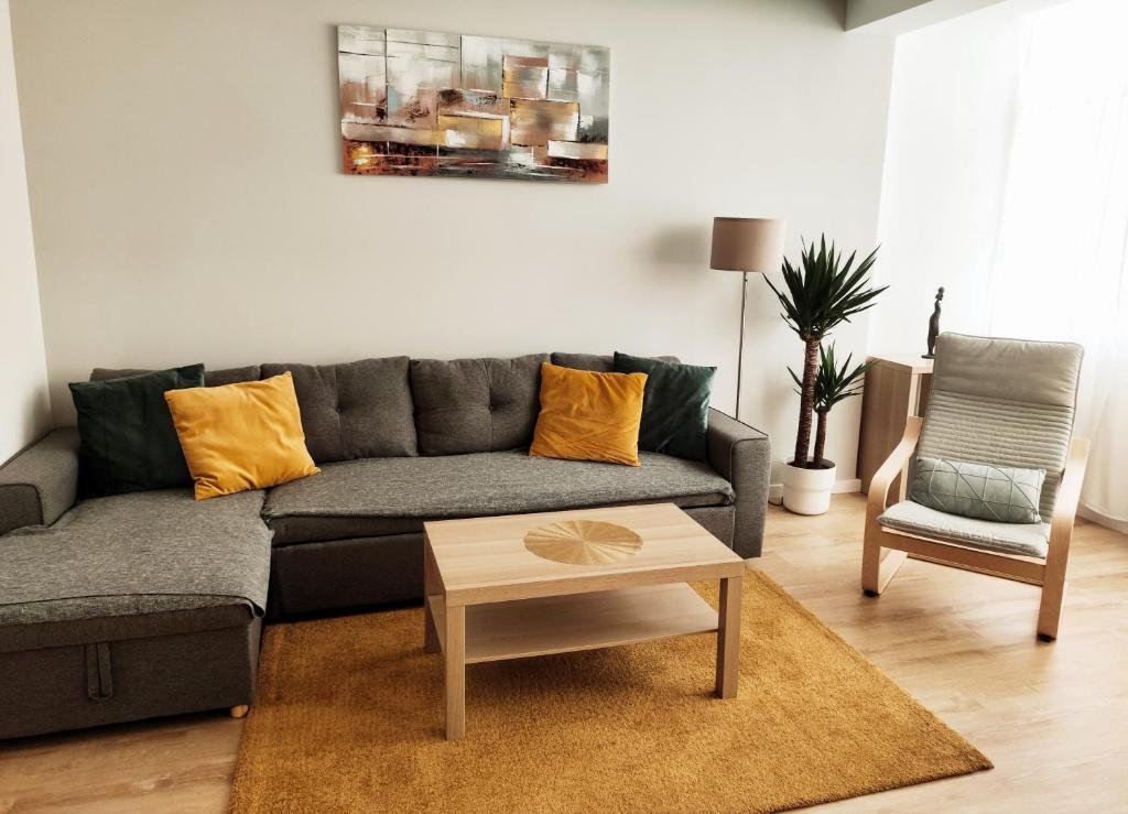 a living room with a couch and a table at Elite House Estoril in Estoril