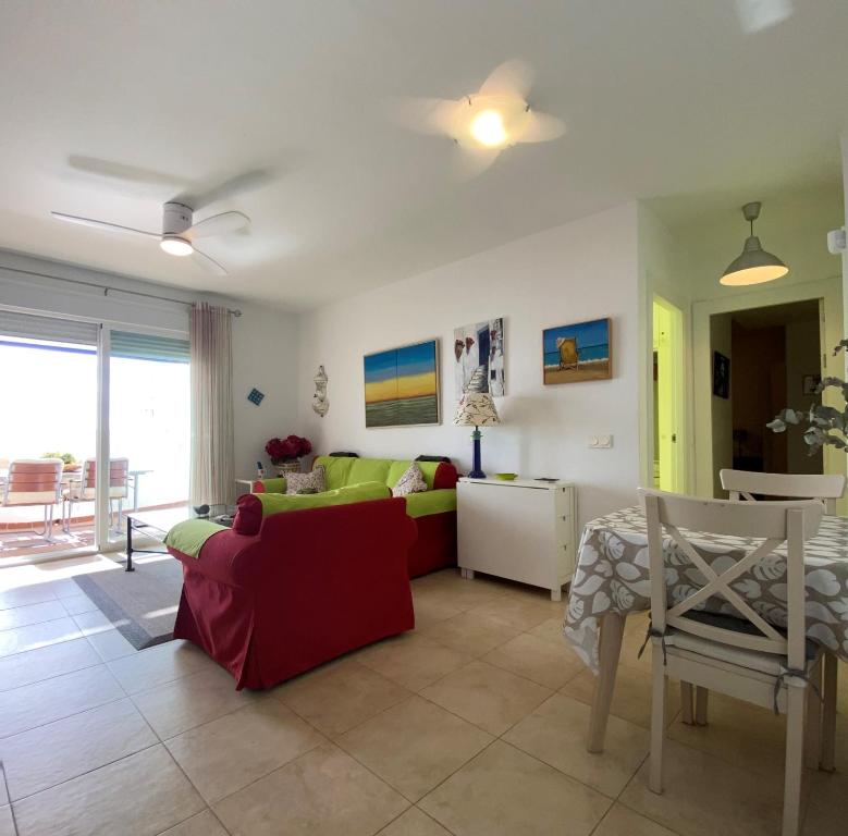 a living room with a couch and a table at RESIDENCIAL OASIS 2 in Mojácar