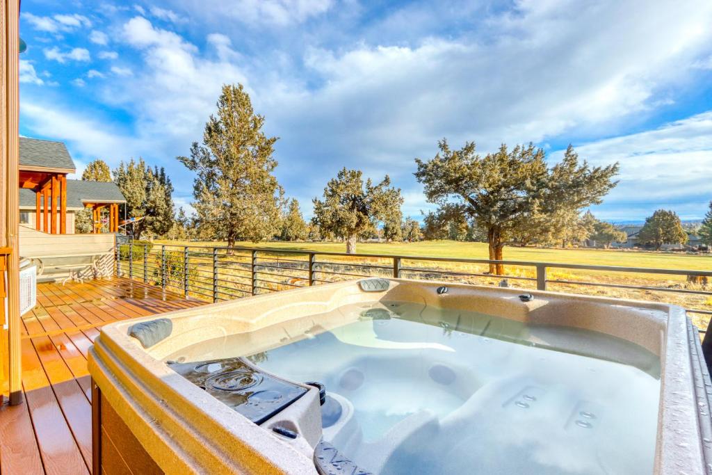 a hot tub on the deck of a house at Cinnamon Teal Dream in Redmond