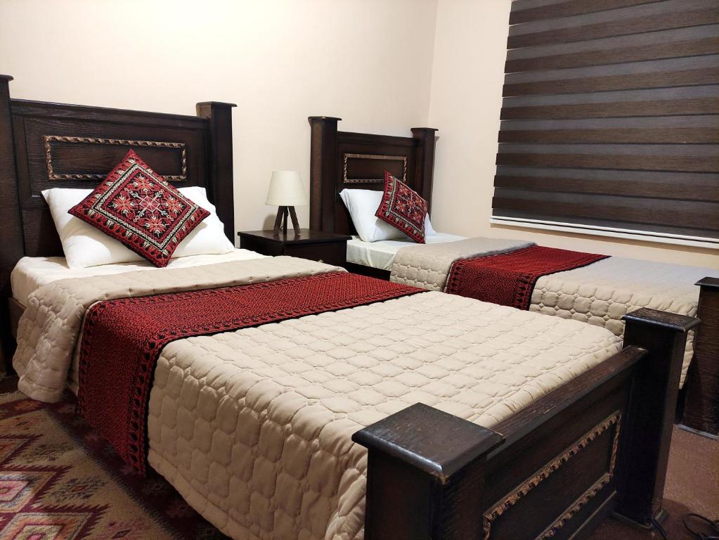 Postelja oz. postelje v sobi nastanitve Majido Hotel