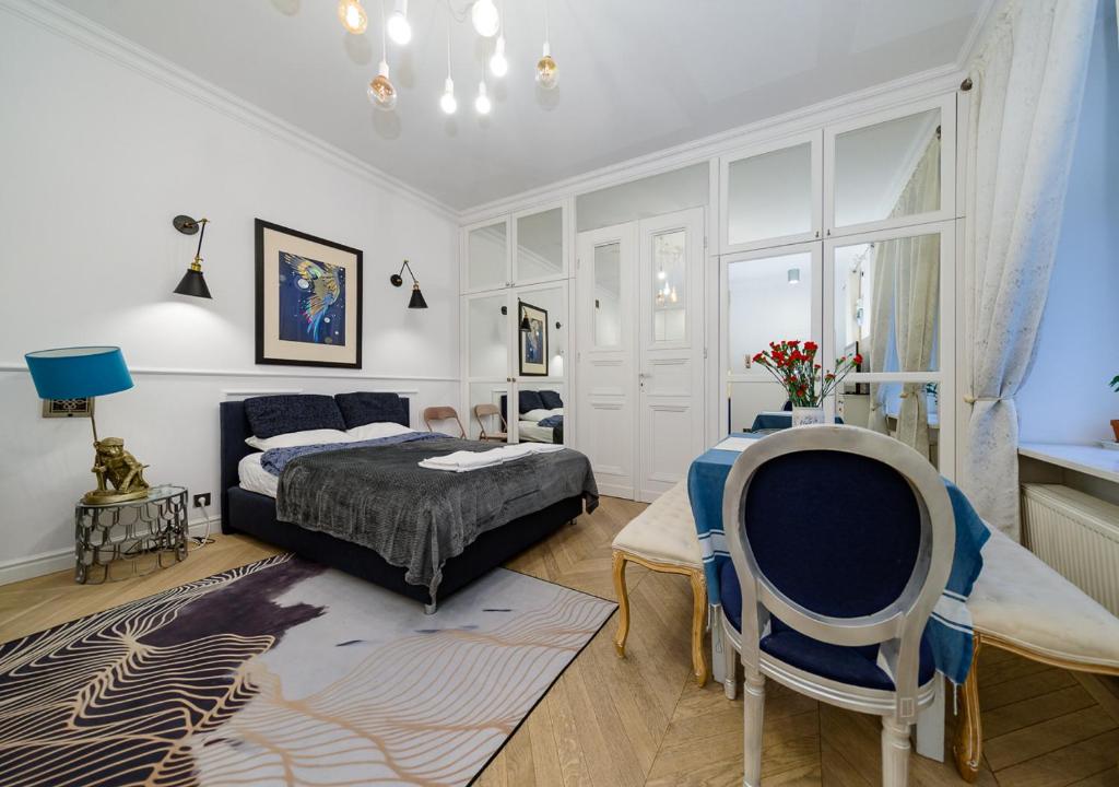 Кровать или кровати в номере Apartament Żurawia street