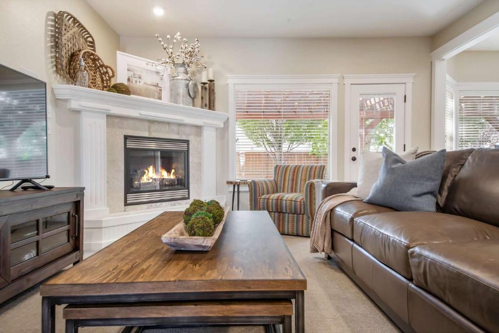 a living room with a couch and a fireplace at Redwick in Meridian