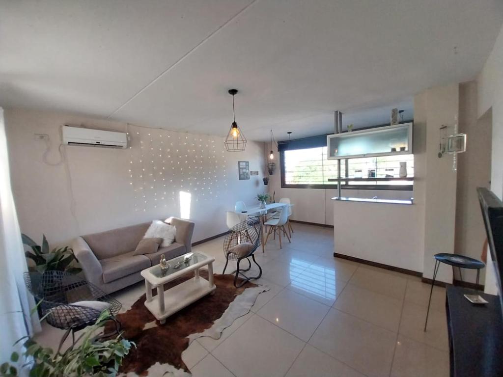 a living room with a couch and a table at Quintana Apartment in Mendoza