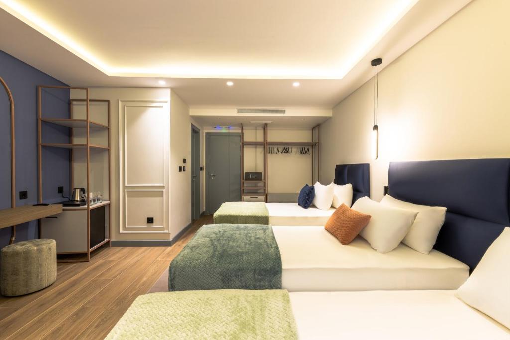 Krevet ili kreveti u jedinici u okviru objekta Calisi Hotel