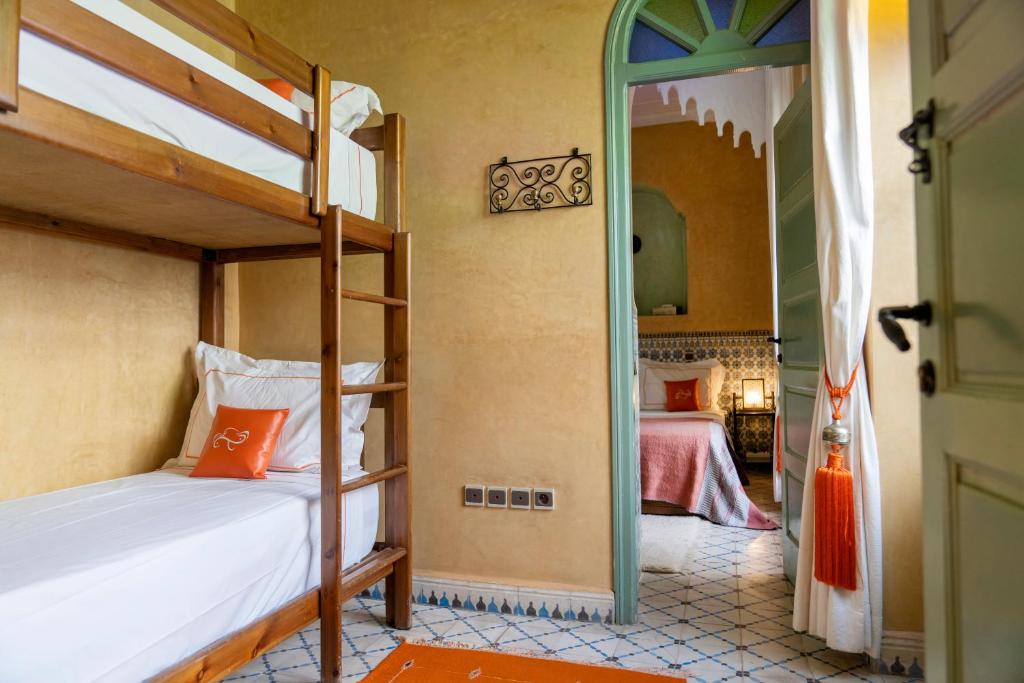 Postel nebo postele na pokoji v ubytování Riad Orange