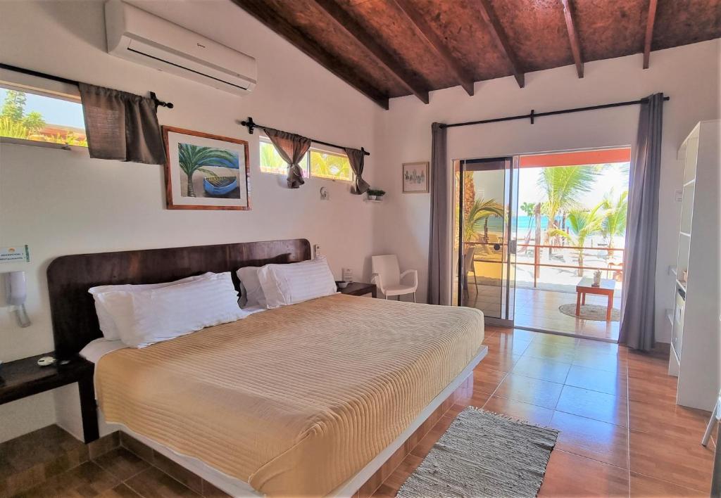 Postel nebo postele na pokoji v ubytování Punta del Norte Bungalows