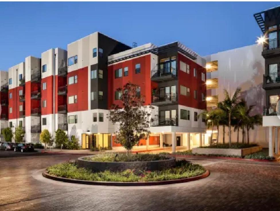 a large building with red and white at A-Class Luxury 2 Bedrooms Apt in Woodland Hills CA in Los Angeles