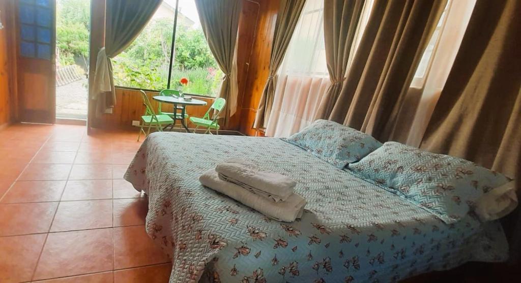 Postel nebo postele na pokoji v ubytování Cabañas Aire Marino Algarrobo