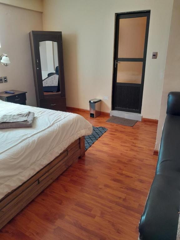 Postel nebo postele na pokoji v ubytování Hostal Nichkito