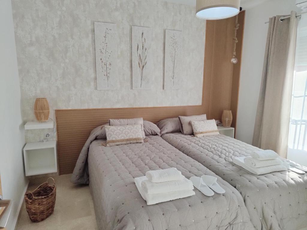 Posteľ alebo postele v izbe v ubytovaní M&D Centro Málaga