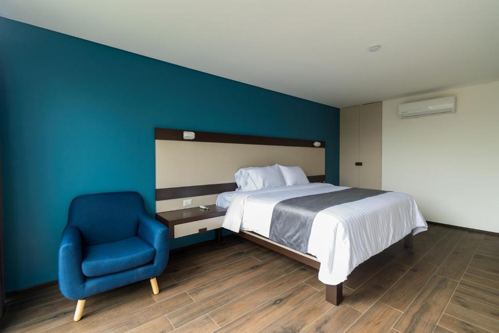 Postel nebo postele na pokoji v ubytování Hotel Balcón del Parque