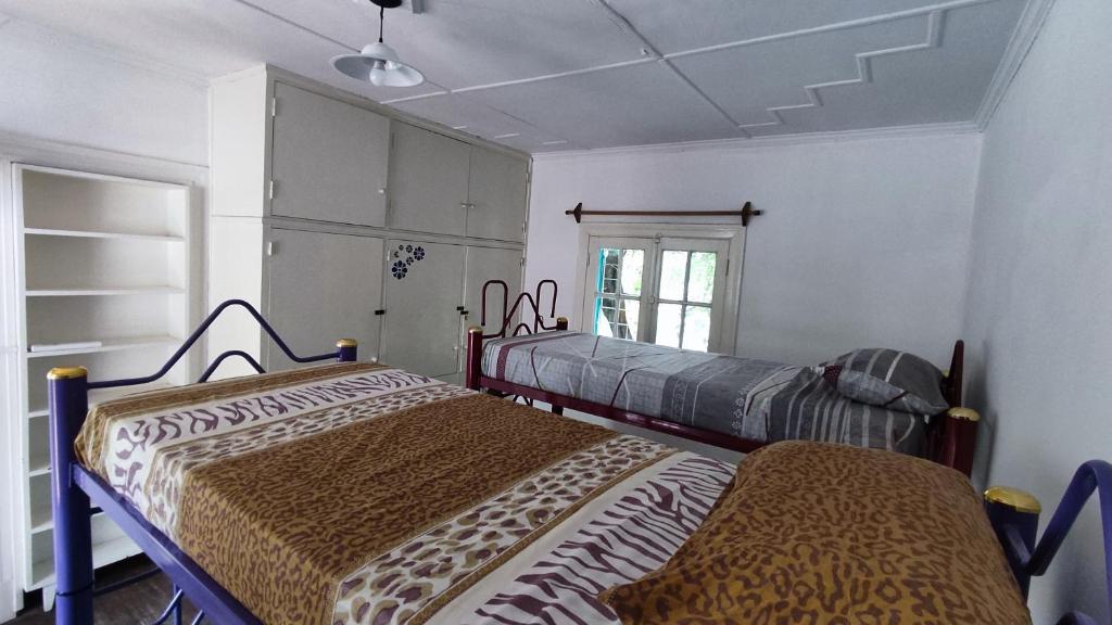 Postel nebo postele na pokoji v ubytování VI&VI HOSTEL MENDOZA