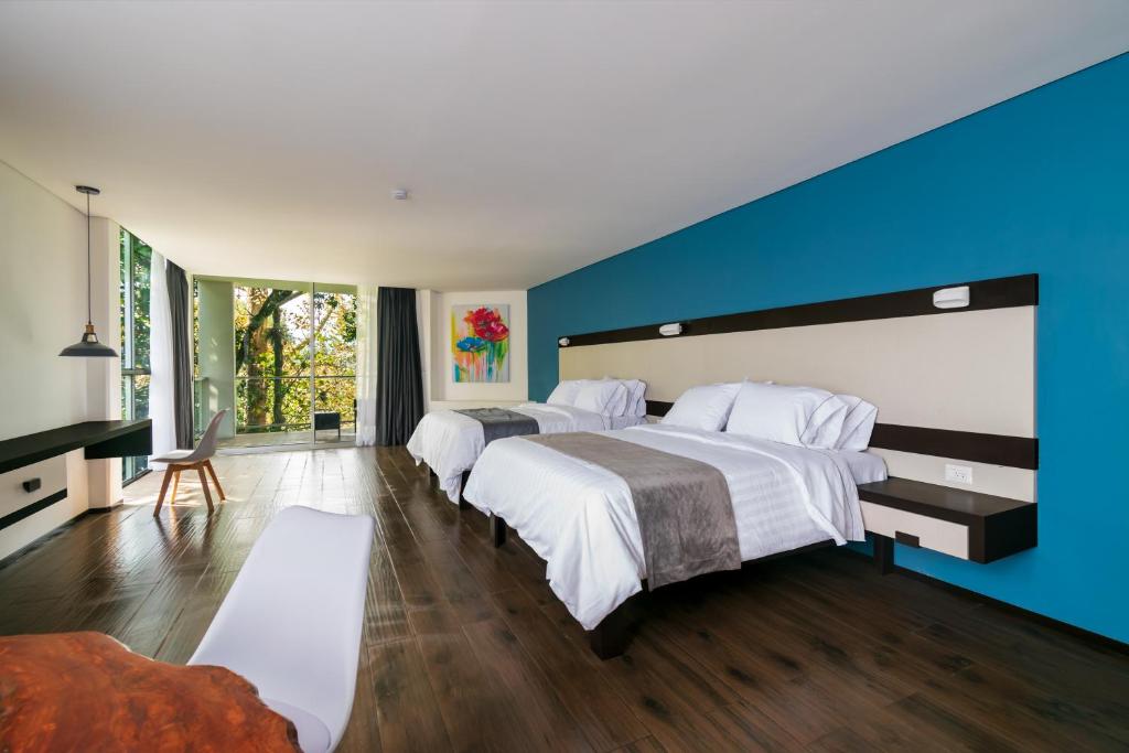 Postel nebo postele na pokoji v ubytování Hotel Balcón del Parque