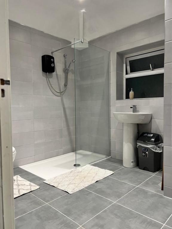 a bathroom with a shower and a sink at semi-detach in Saint Helens