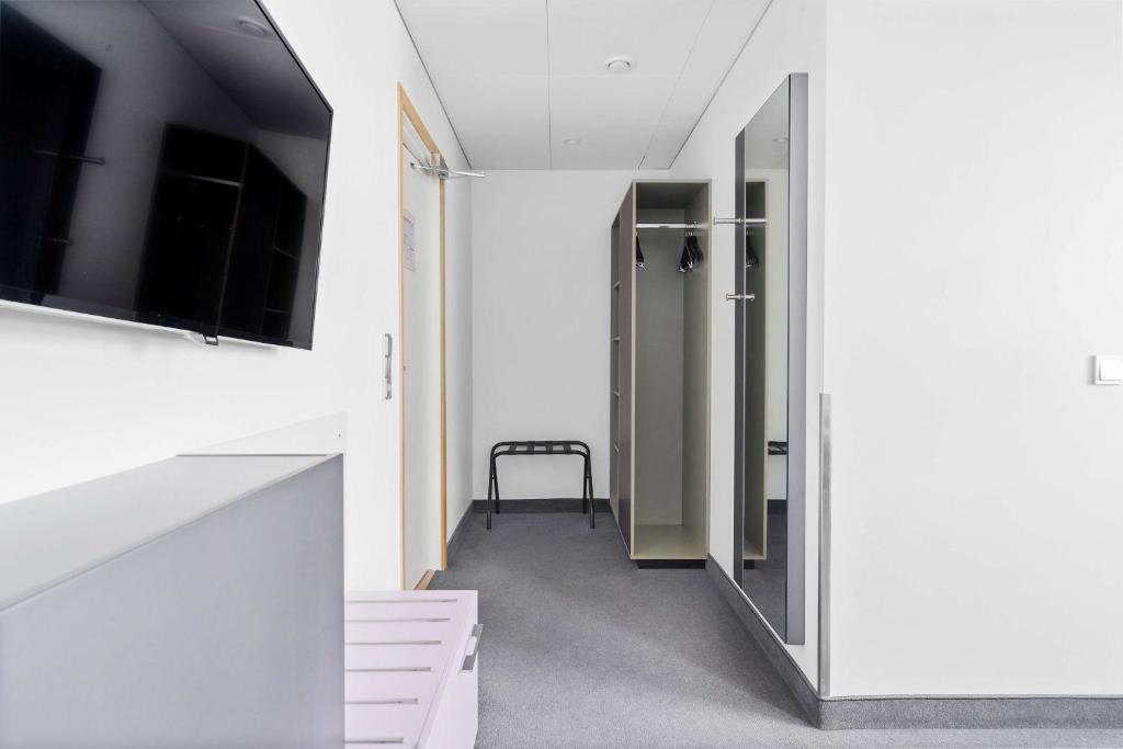 TV a/nebo společenská místnost v ubytování Best Western Plus Airport Hotel
