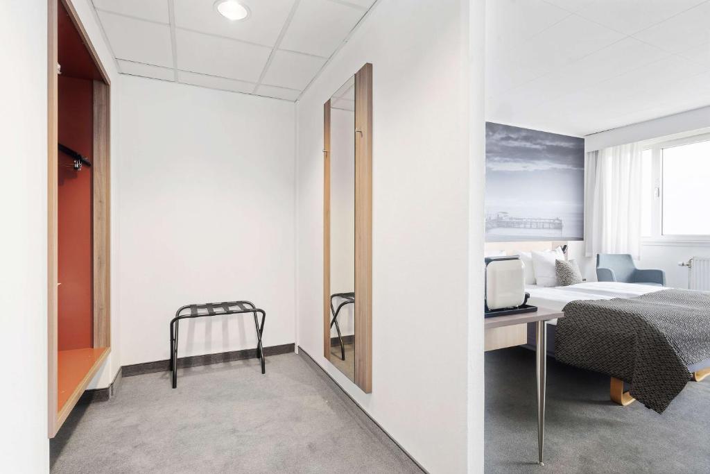 Postel nebo postele na pokoji v ubytování Best Western Plus Airport Hotel