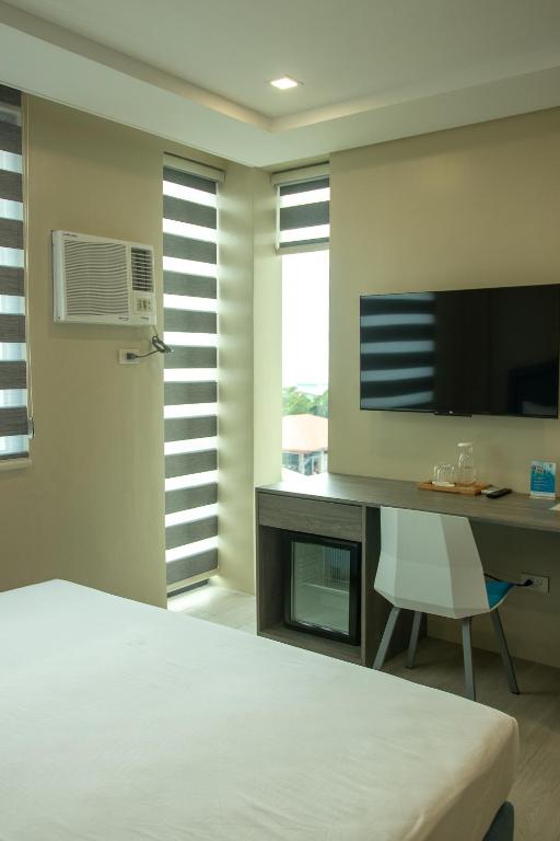 TV a/nebo společenská místnost v ubytování Seeya Hotel