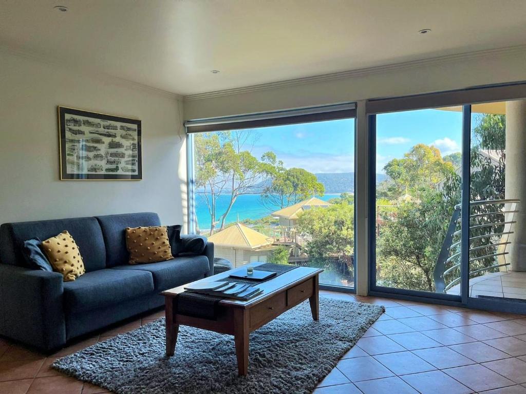 a living room with a couch and a coffee table at Vista Di Mare in Lorne